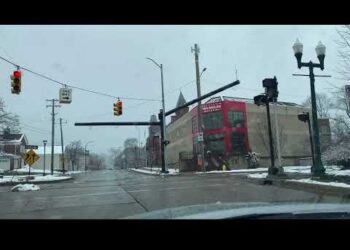 Pleasant drive through Depot Town in Ypsilanti Michigan on a snowy winter day.