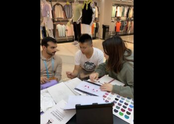 Helping Canton Fair buyer searching sport clothes manufactures in Guangzhou China as an interpreter.