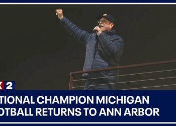 National champion Michigan football returns to Ann Arbor