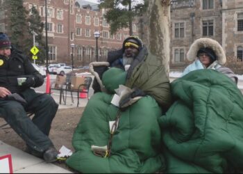 Survivor of UM sports doctor sex abuse chains self to tree in protest