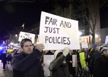 Protesters march downtown Ann Arbor for the anniversary of Aura Rosser's death