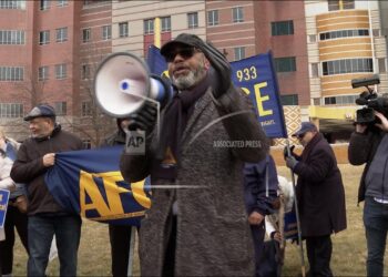 Dozens march, chant outside Detroit VA during rally on behalf of fired federal workers