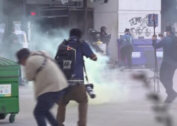 Police and protesters clash outside federal detention center in LA after ICE raids