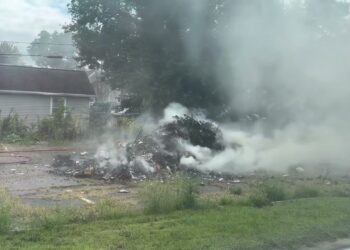 Garbage truck load catches fire in Ypsilanti, MI